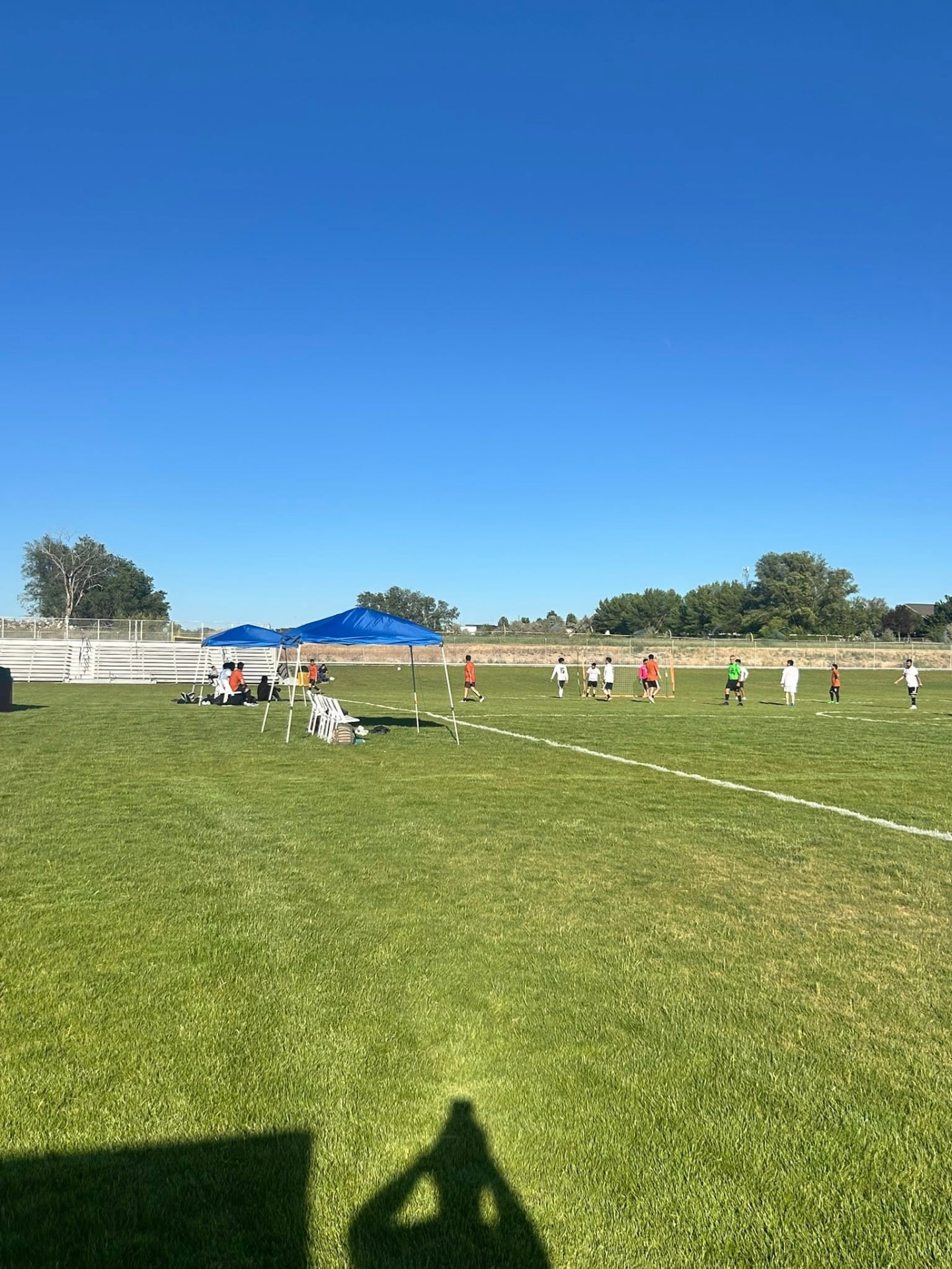 The Copa Tricolor pitches from the sideline under blue canopies